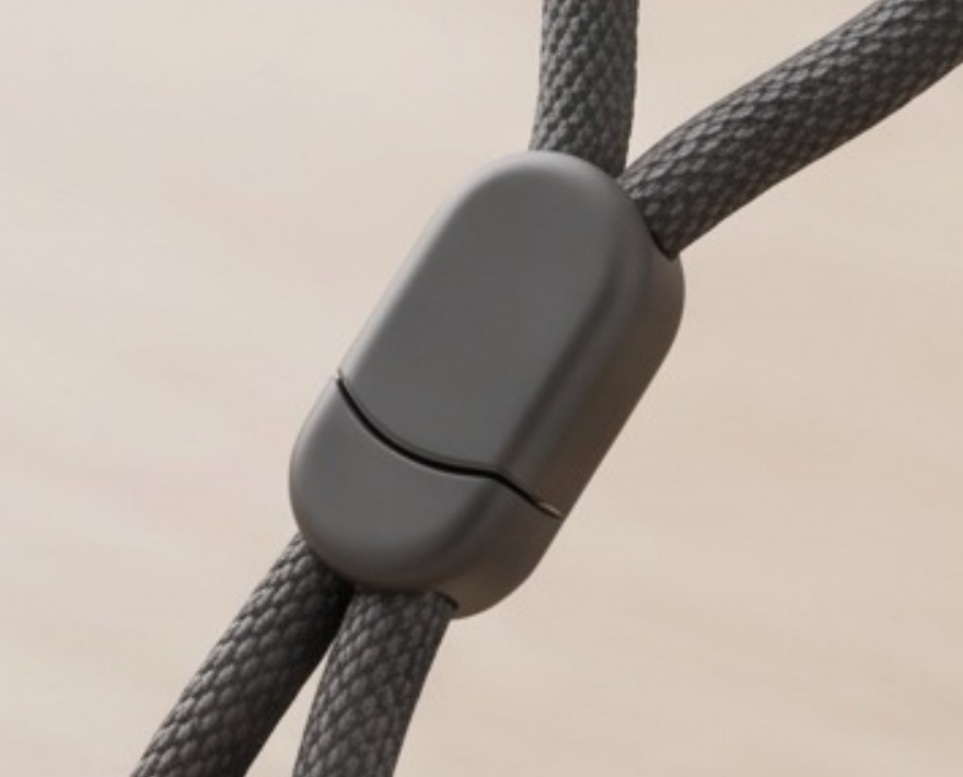 The breakaway clip on the pendant's lanyard.